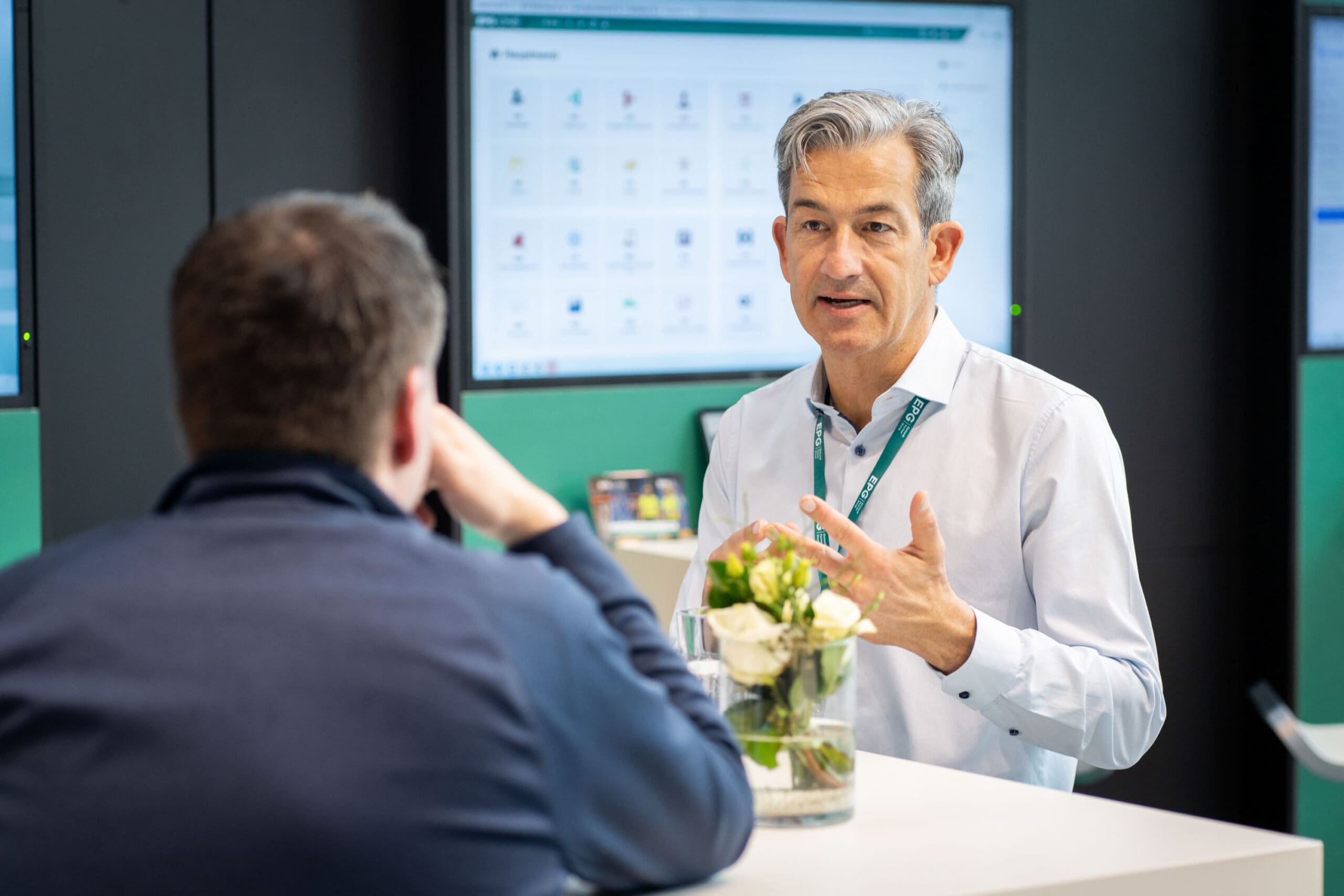 Two people having a business discussion at a table.
